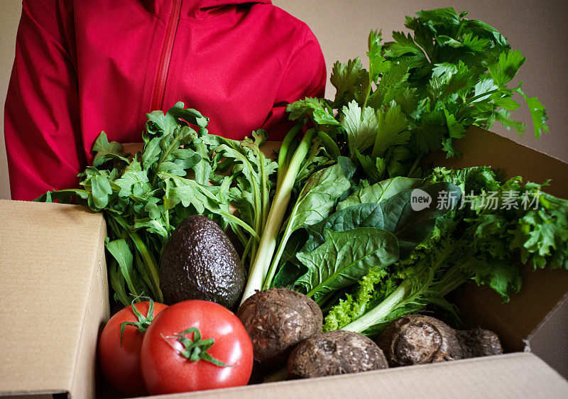 Delivery of assorted vegetables in cardboard boxes